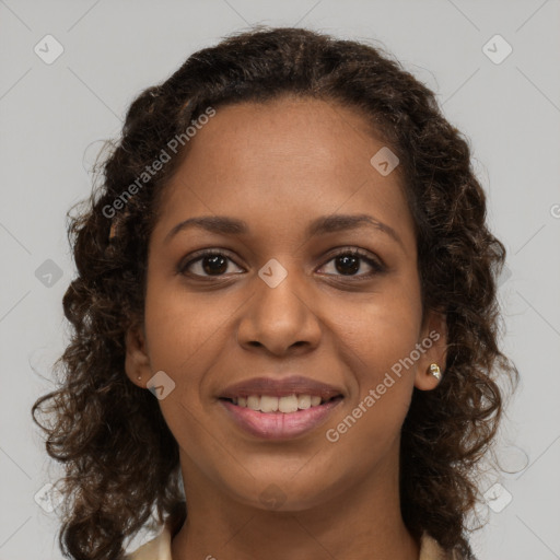 Joyful black young-adult female with medium  brown hair and brown eyes