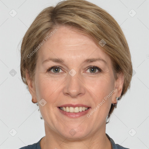 Joyful white adult female with medium  brown hair and grey eyes