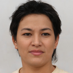 Joyful asian young-adult female with short  brown hair and brown eyes