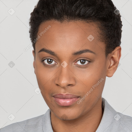 Joyful black young-adult female with short  brown hair and brown eyes