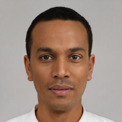 Neutral latino young-adult male with short  black hair and brown eyes