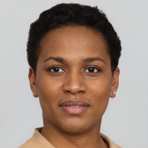 Joyful black young-adult female with short  brown hair and brown eyes