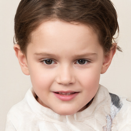 Joyful white child female with short  brown hair and brown eyes