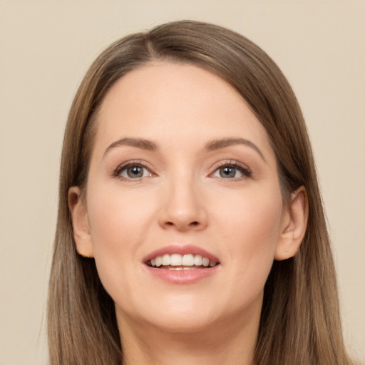 Joyful white young-adult female with long  brown hair and brown eyes