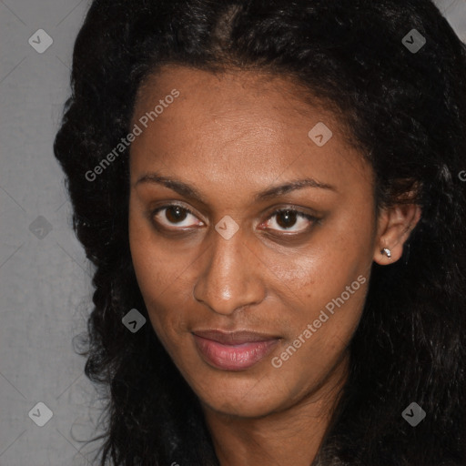 Joyful black young-adult female with long  brown hair and brown eyes