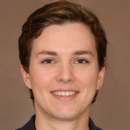 Joyful white young-adult female with short  brown hair and grey eyes