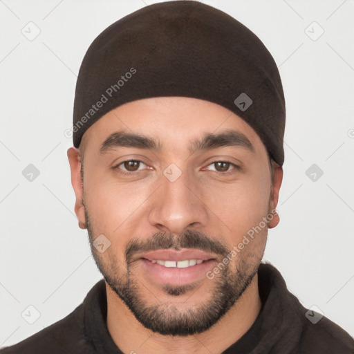 Joyful white young-adult male with short  black hair and brown eyes