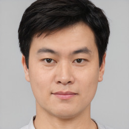 Neutral asian young-adult male with short  black hair and brown eyes