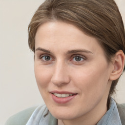 Joyful white young-adult female with medium  brown hair and grey eyes