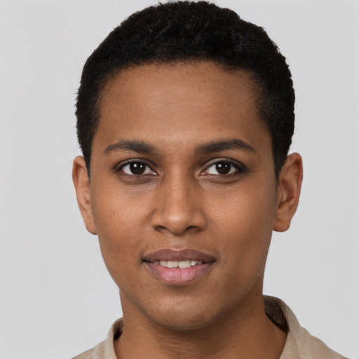 Joyful black young-adult male with short  brown hair and brown eyes