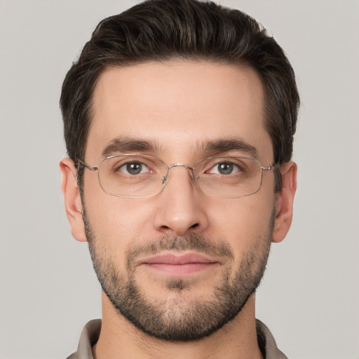 Joyful white young-adult male with short  brown hair and brown eyes