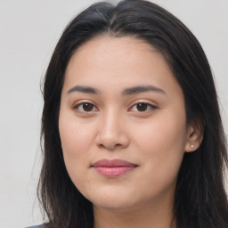 Joyful asian young-adult female with long  brown hair and brown eyes