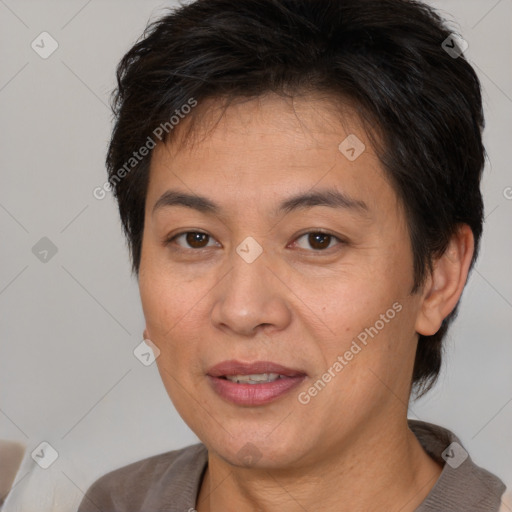 Joyful white adult female with short  brown hair and brown eyes