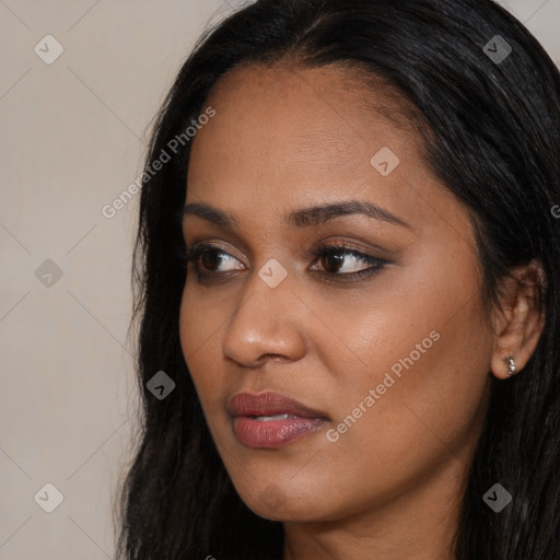 Joyful latino young-adult female with long  black hair and brown eyes