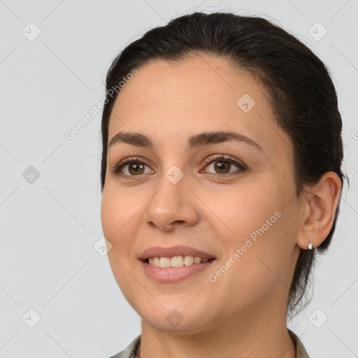 Joyful white young-adult female with medium  brown hair and brown eyes