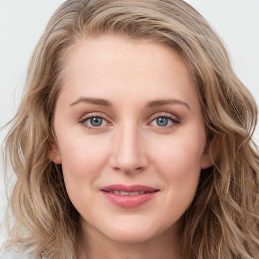 Joyful white young-adult female with long  brown hair and blue eyes