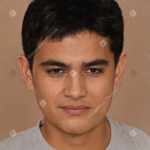 Joyful latino young-adult male with short  brown hair and brown eyes