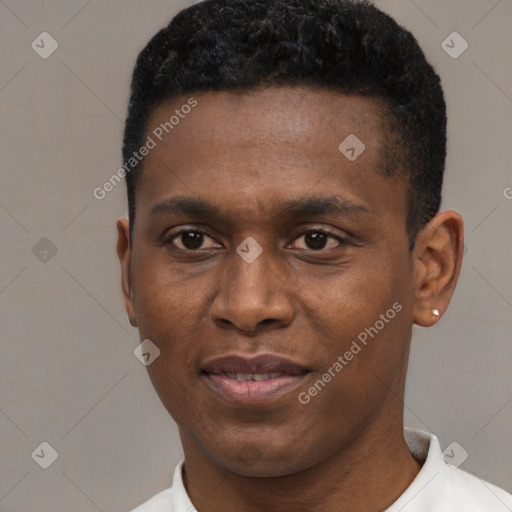 Joyful black young-adult male with short  black hair and brown eyes