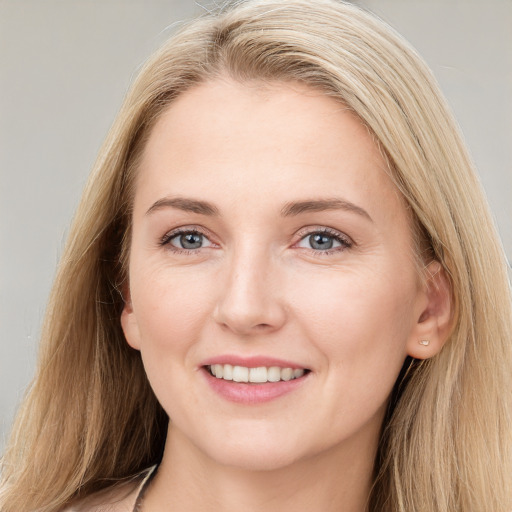 Joyful white young-adult female with long  brown hair and grey eyes