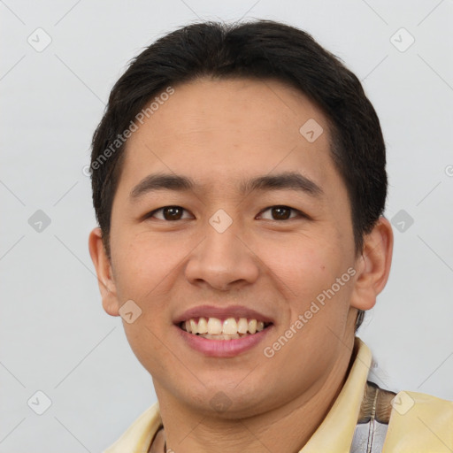 Joyful asian young-adult male with short  brown hair and brown eyes