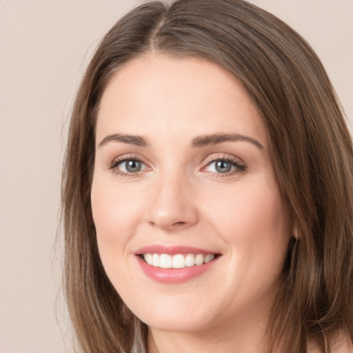 Joyful white young-adult female with long  brown hair and brown eyes