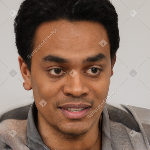 Joyful latino young-adult male with short  black hair and brown eyes