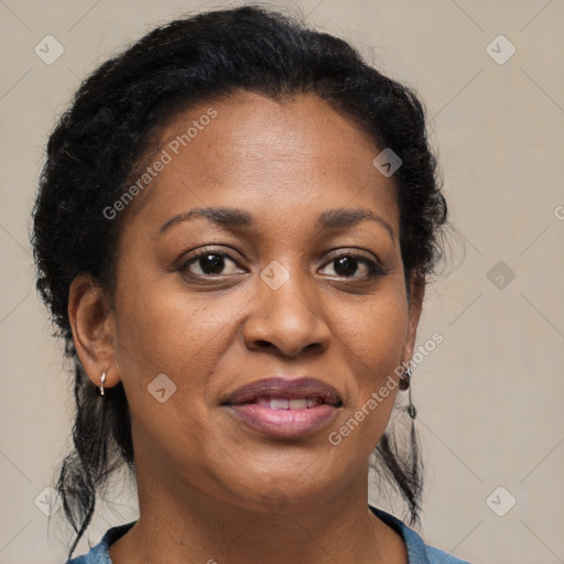 Joyful black adult female with medium  brown hair and brown eyes