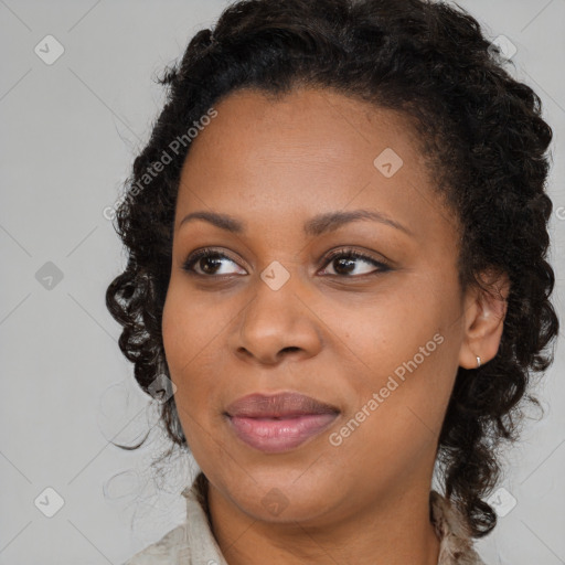 Joyful black young-adult female with medium  brown hair and brown eyes