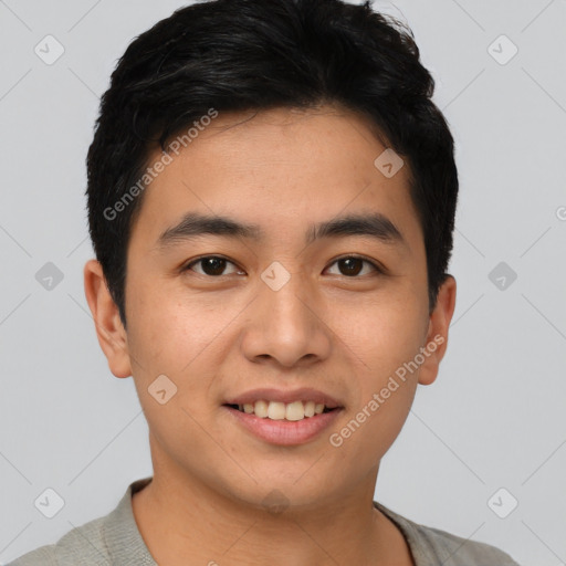 Joyful asian young-adult male with short  black hair and brown eyes