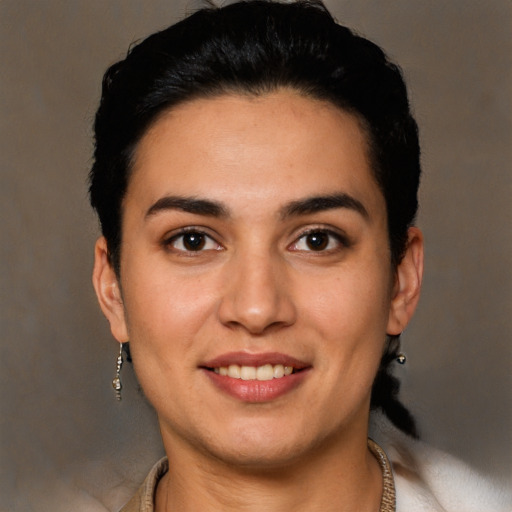 Joyful white young-adult female with short  black hair and brown eyes