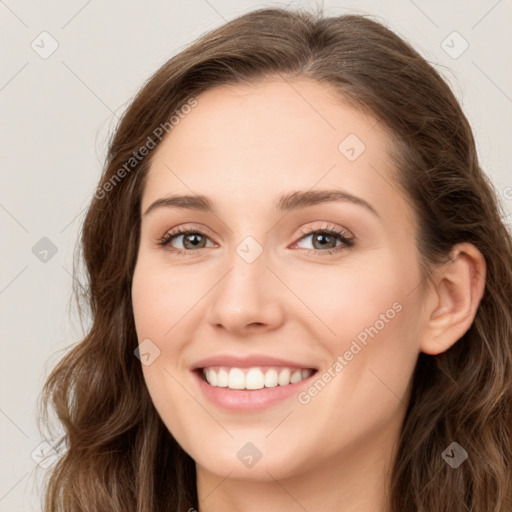 Joyful white young-adult female with long  brown hair and green eyes