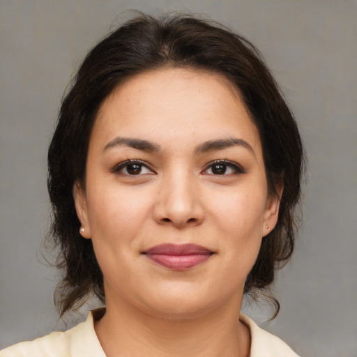 Joyful asian young-adult female with medium  brown hair and brown eyes