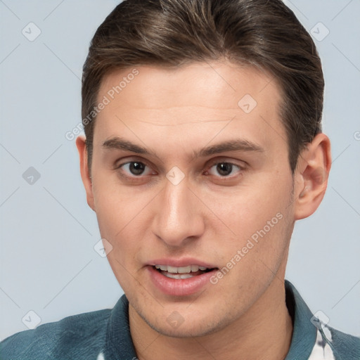 Joyful white young-adult male with short  brown hair and brown eyes