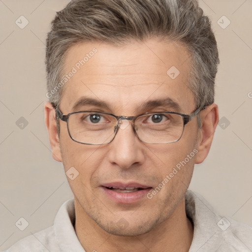 Joyful white adult male with short  brown hair and brown eyes