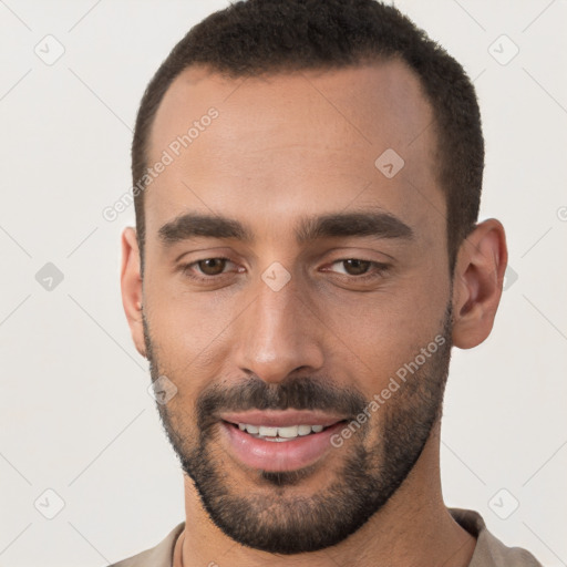 Joyful white young-adult male with short  brown hair and brown eyes