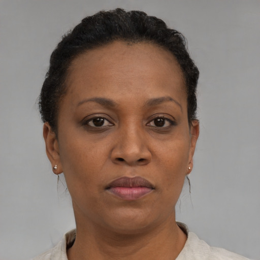 Neutral black adult female with short  brown hair and brown eyes