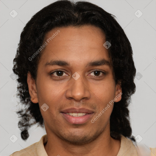 Joyful black young-adult male with short  brown hair and brown eyes