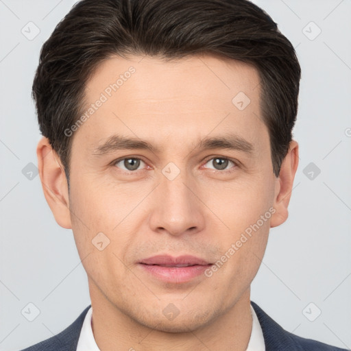 Joyful white young-adult male with short  brown hair and brown eyes