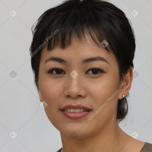 Joyful asian young-adult female with short  brown hair and brown eyes