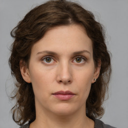 Neutral white young-adult female with medium  brown hair and grey eyes