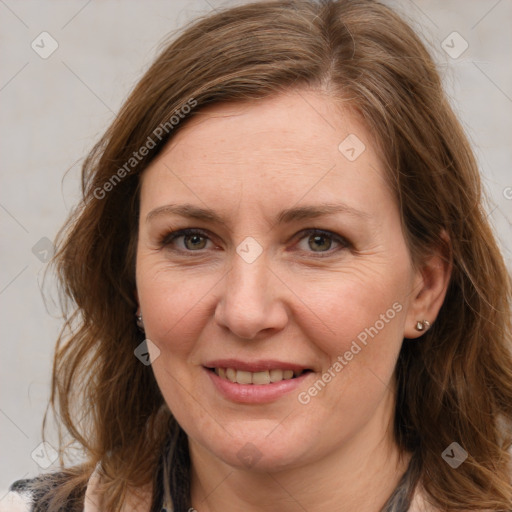 Joyful white adult female with long  brown hair and brown eyes