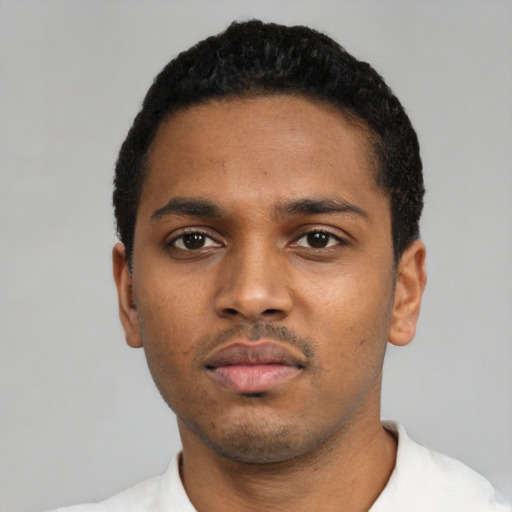 Neutral black young-adult male with short  black hair and brown eyes