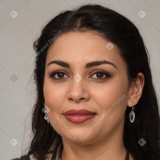 Joyful latino young-adult female with long  brown hair and brown eyes