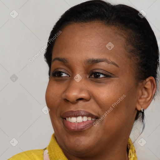 Joyful black young-adult female with medium  brown hair and brown eyes