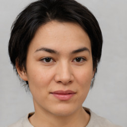 Joyful asian young-adult female with medium  black hair and brown eyes