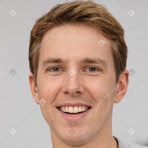 Joyful white adult male with short  brown hair and grey eyes