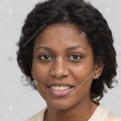 Joyful black young-adult female with long  brown hair and brown eyes