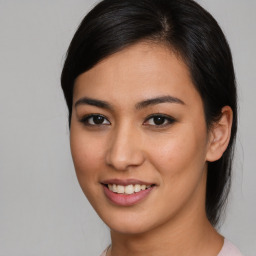 Joyful asian young-adult female with medium  brown hair and brown eyes