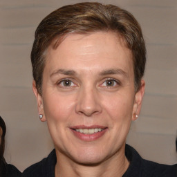 Joyful white adult female with short  brown hair and brown eyes