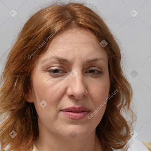 Joyful white adult female with medium  brown hair and blue eyes